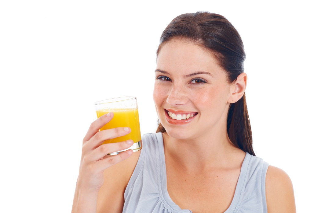 Women drinking orange juice for Vitamin C